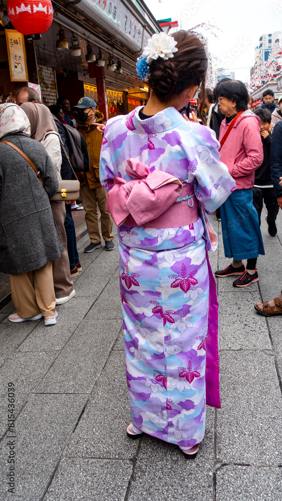 Tokyo, Japan – April 2024 : unidentified foreigner tourists wearing yukata (kimono) the national tradition costume of Japan walking at Sensoji temple the famous temple in Tokyo, Japan Tokyo, Japan – April 2024 : unidentified foreigner tourists wearing yukata (kimono) the national tradition costume of Japan walking at Sensoji temple the famous temple in Tokyo, Japan