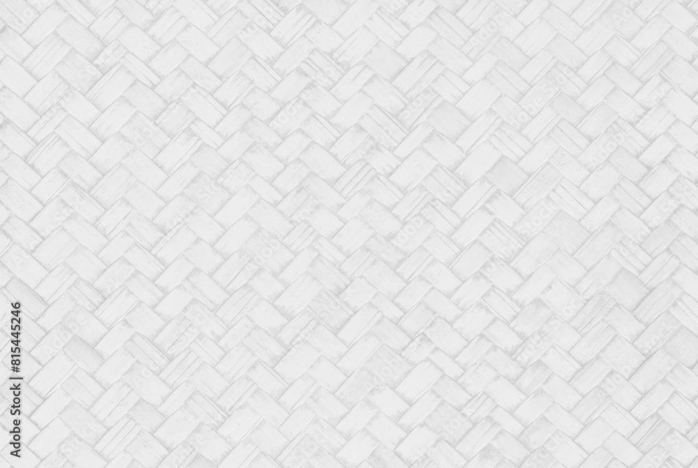 Fototapeta premium White bamboo weaving pattern, woven rattan mat texture for background and design art work.