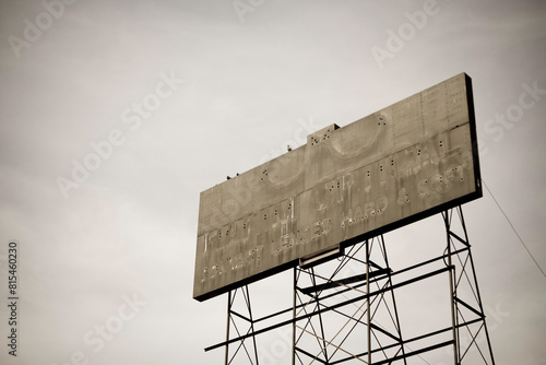 Schilderij op canvas Abandoned billboard former neon sign trace of glasses