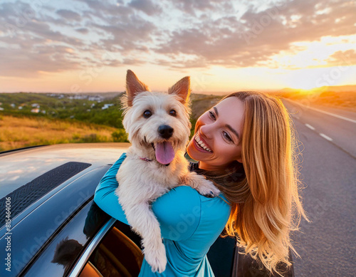 smiling happy cheerful young blonde woman with cute dog front car at sunset