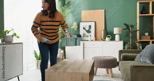 Woman, housekeeper and cleaning with timelapse for hygiene or domestic service in living room at home. Female person, maid or cleaner wiping surfaces and furniture for tidy house or dirt removal photo