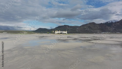 Aerial push in of the Great Saltair venue on the shore of the Great Salt Lake, Utah on a sunny spring day. photo