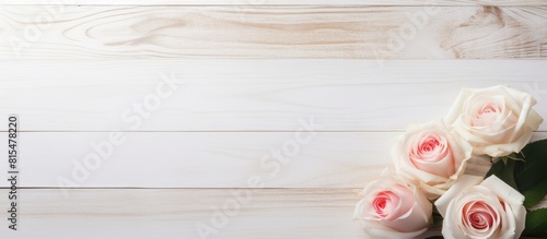 A white wooden table with a shade is adorned with beauty product samples and roses creating a visually appealing copy space image © HN Works