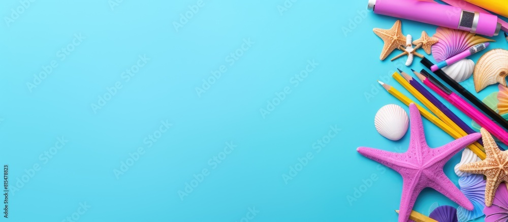 Fototapeta premium A pop art concept for back to school with a mix of school stationery and a seashell on a vibrant pink and blue background The top view shows pens pencils and a gon on a pastel background providing am