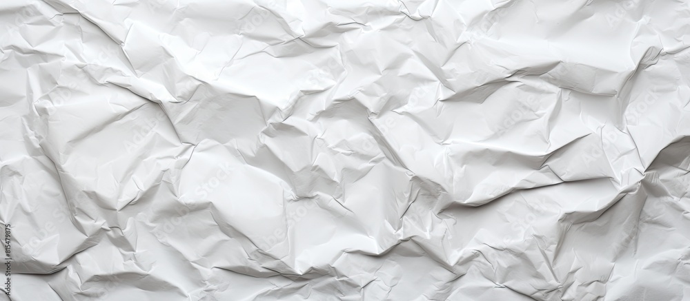 The crumpled paper has a white color texture background perfect for a copy space image The crumpled paper has a white color texture background perfect for a copy space image