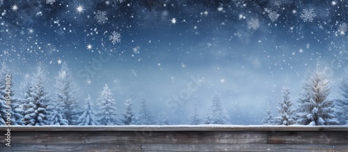 A blue painted weathered wooden plank with a snowy background creates a festive and wintry atmosphere making it an ideal image for the holidays specifically Merry Christmas and New Year This copy spa