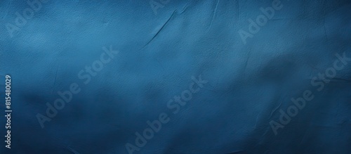 A background with a textured appearance resembling deep blue paper perfect for incorporating copy space image