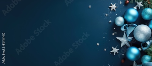 A blue background with New Year s decorations including the inscription Merry Christmas The image features a flat lay view with copy space available for customization