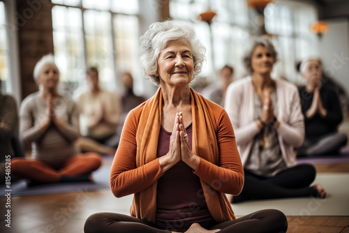 elderly womans with grey hair is practicing yoga  background with selective focus  copy space