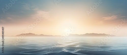 A misty sunrise over the ocean with fog obscuring the view. Creative banner. Copyspace image