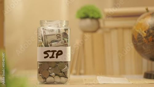 PERSON SAVING MONEY FOR SIP