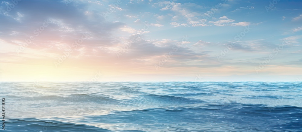 Obraz premium A calming scene of the ocean s serene surface with the soft morning light creating a textured effect Copy space image