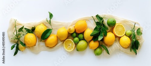 Flat lay copy space image showcasing the zero waste concept with a variety of eco friendly bags including string mesh and grocery bags A lemon sits on a white background adding a fresh touch Top view