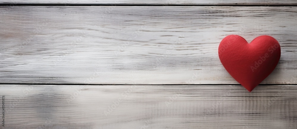 Valentine s Day copy space image featuring a red heart on a weathered white wooden background Valentine s Day copy space image featuring a red heart on a weathered white wooden background