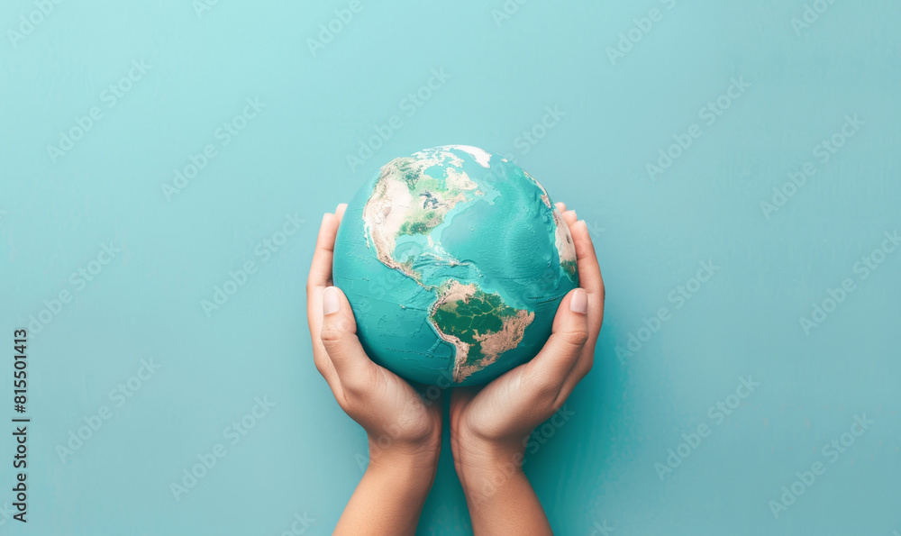 A person is holding a globe in their hands A person is holding a globe in their hands