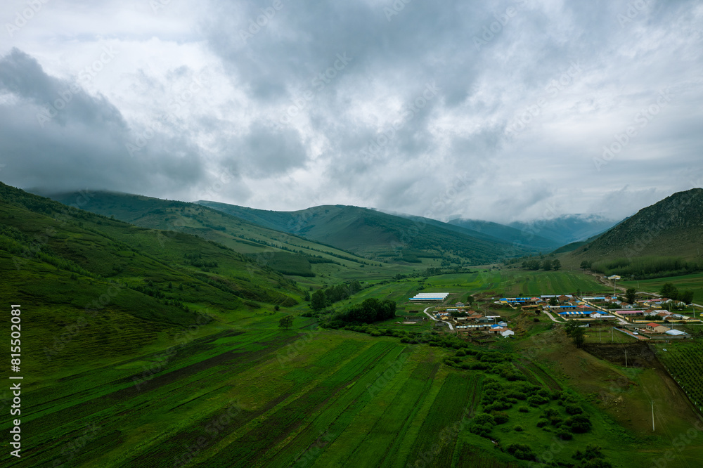 Fototapeta premium Aerial photography of the road in the Huangganliang Valley of the Greater Hinggan Mountains on the Rea Line in Keshiketeng Banner, Chifeng City