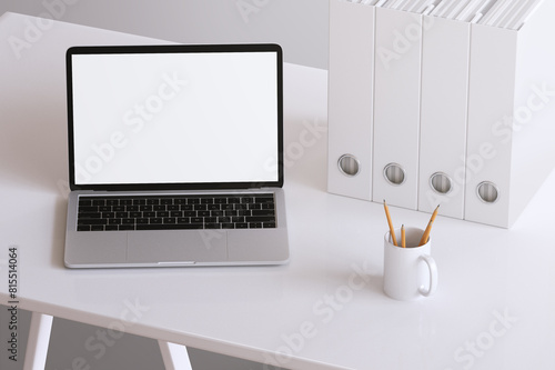 Mockup of laptop screen device. Website presentation. Office workspace concept.
