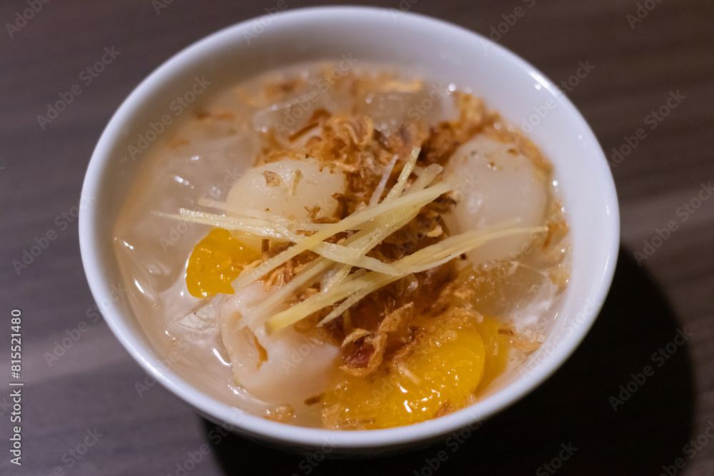 Sohm Choon; Fruit dessert of lychee, green mango, young ginger in jasmine, bitter orange, and pandan-scented sweet and salty syrup. A type of dessert known as laawy gaaeo. Traditional Thai desserts. Sohm Choon; Fruit dessert of lychee, green mango, young ginger in jasmine, bitter orange, and pandan-scented sweet and salty syrup. A type of dessert known as laawy gaaeo. Traditional Thai desserts.