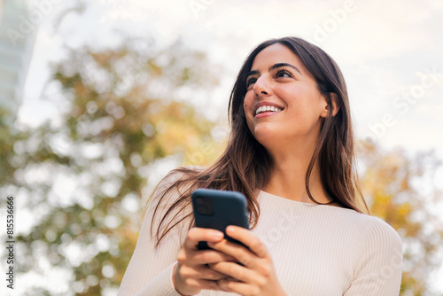 caucasian woman smiling happy using mobile phone