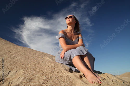 young woman on sandy mountain