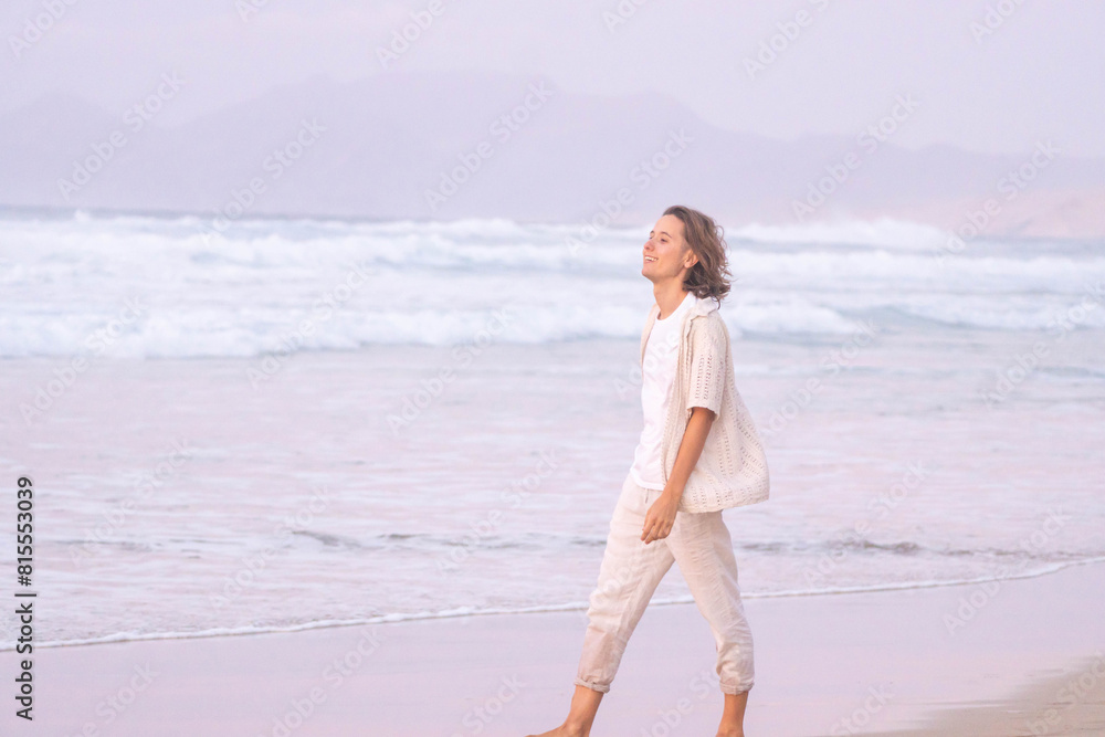 Peaceful stroll along the sandy beach at sunset for a young woman, with the gentle waves and soft pastel colors creating a tranquil atmosphere Peaceful stroll along the sandy beach at sunset for a young woman, with the gentle waves and soft pastel colors creating a tranquil atmosphere
