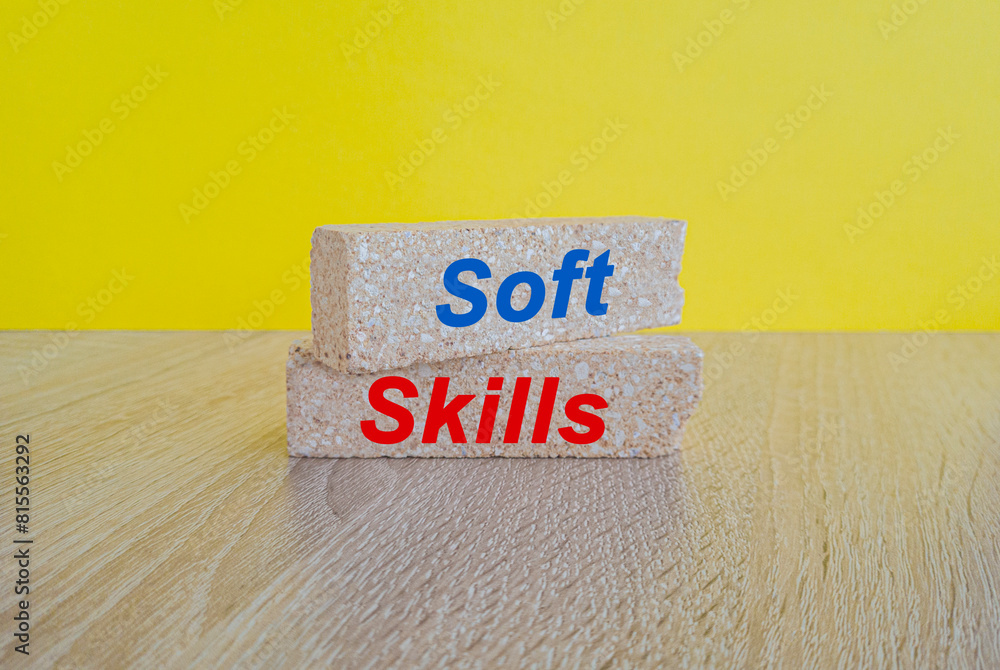 Soft skills symbol. Concept red words Soft skills on brick blocks. Beautiful yellow background, wooden table. Business and Soft skills concept. Soft skills symbol. Concept red words Soft skills on brick blocks. Beautiful yellow background, wooden table. Business and Soft skills concept.