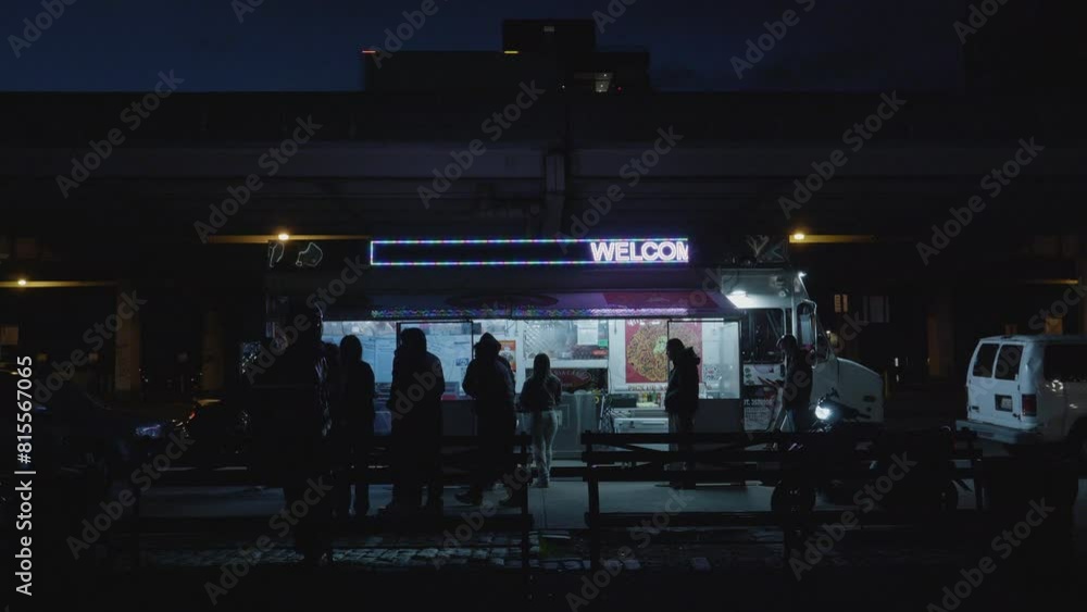 Handheld shot of customers ordering food from a taco truck Handheld shot of customers ordering food from a taco truck