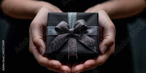 Black gift boxes with hands 