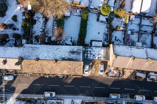 Aerial drone photo of the village of Golcar in West Yorkshire, England, Huddersfield in the UK showing the residential houses estates in the winter time with small patches of snow on the ground. photo