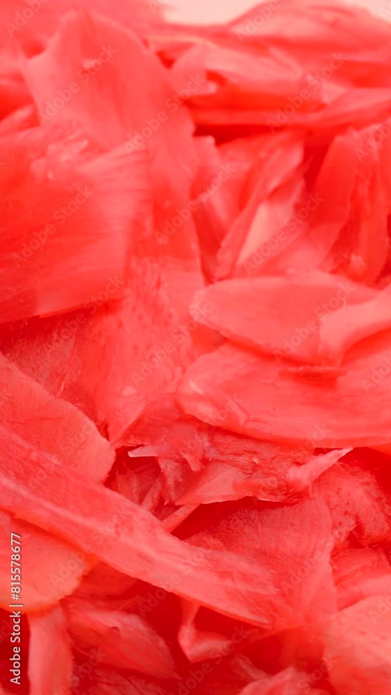 Bright Red pickled ginger for sushi rolls, rotation in circle. pickled ginger, Turning. Japanese cuisine. Vertical video
Bright Red pickled ginger for sushi rolls, rotation in circle. pickled ginger, Turning. Japanese cuisine. Vertical video
