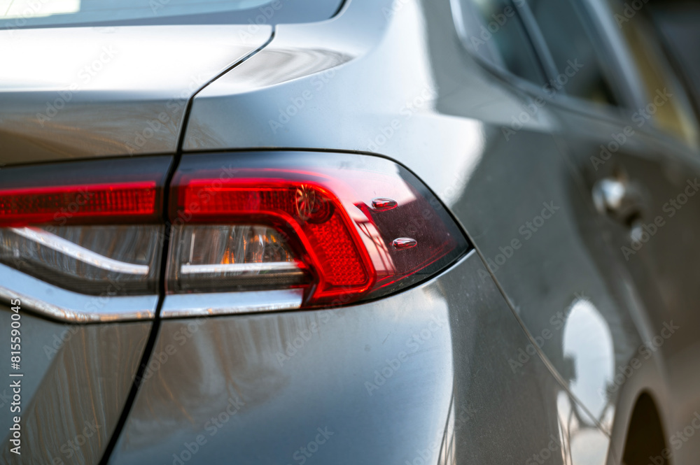 Close-up of car tail lights. Selective focus and shallow depth of field. Transportation background Close-up of car tail lights. Selective focus and shallow depth of field. Transportation background