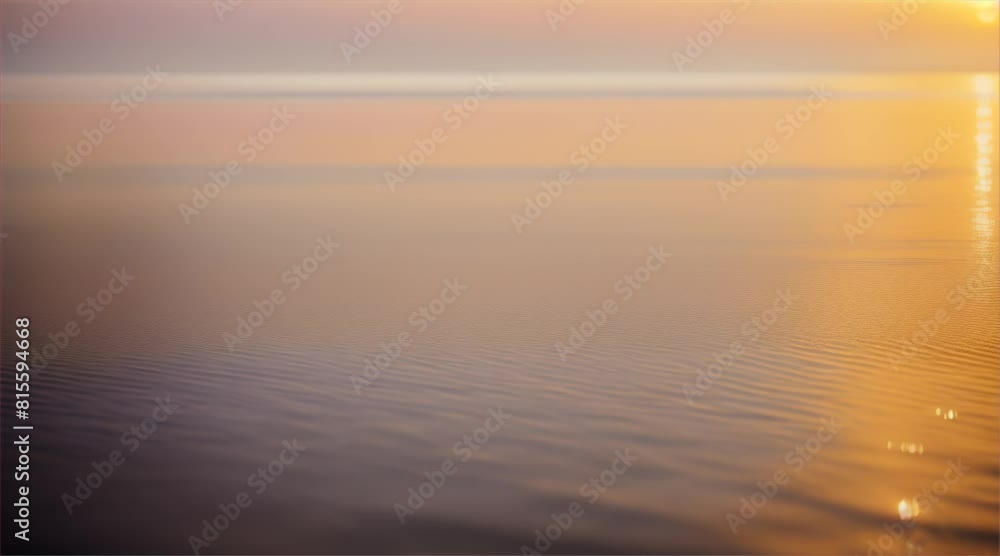Sunlight hits the surface of the water causing golden light to reflect off the water waves. Sunlight hits the surface of the water causing golden light to reflect off the water waves.