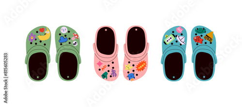 Set of crocs with embellishments. Unisex slates. Trendy vector illustration.