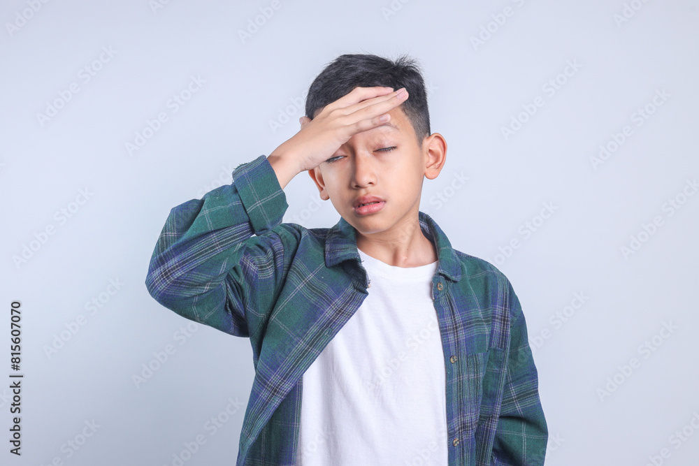 Little Boy Touching Head Having Headache and Problems Isolated on Grey Background Little Boy Touching Head Having Headache and Problems Isolated on Grey Background
