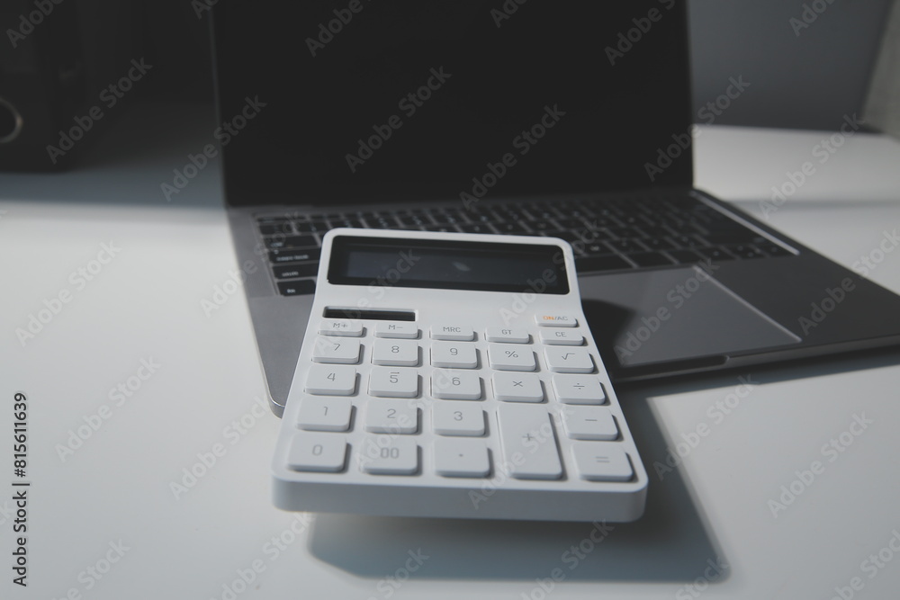 Flat lay, top view office table desk. Workspace with calculator,pen,laptop on white background.Copy Space for text,Empty Blank to word.Business Finance,Education Technology.Work from home. Flat lay, top view office table desk. Workspace with calculator,pen,laptop on white background.Copy Space for text,Empty Blank to word.Business Finance,Education Technology.Work from home.