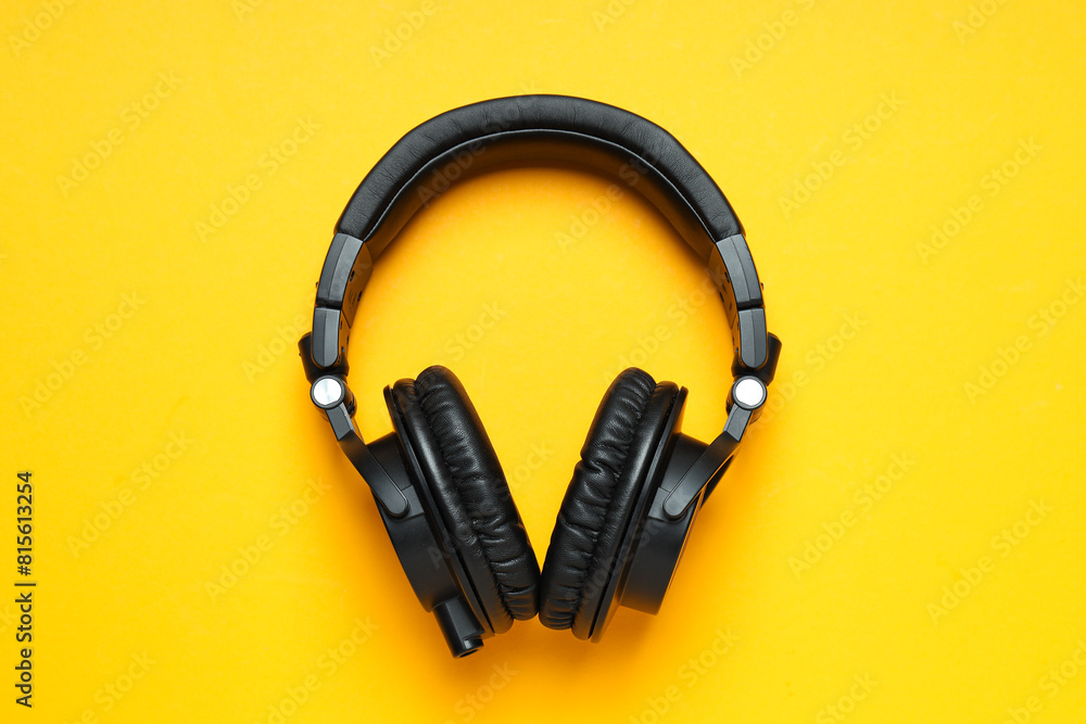 Fototapeta premium Over-ear, black headphones, on a dark background.