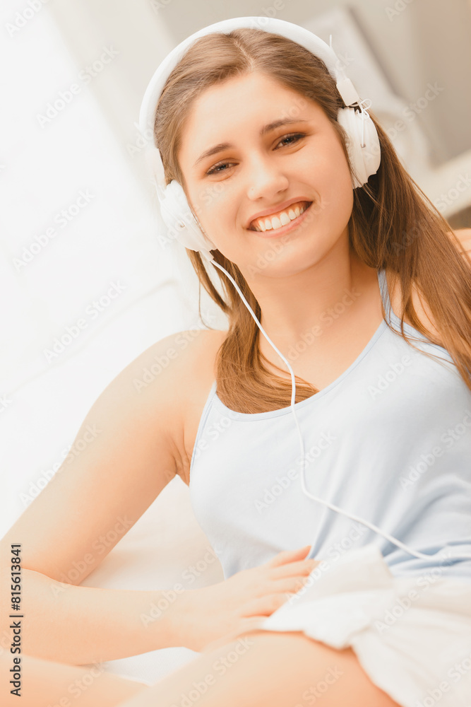 Comfortably lying, enjoys soothing melodies on couch Comfortably lying, enjoys soothing melodies on couch