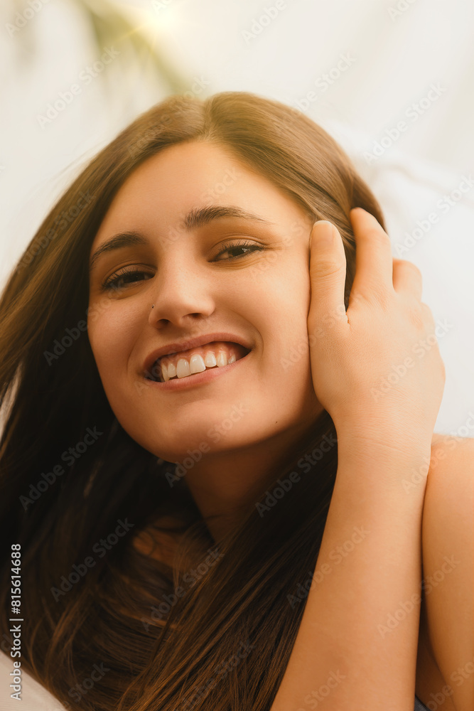Relaxed, cheerful woman enjoys home's cozy corner Relaxed, cheerful woman enjoys home's cozy corner