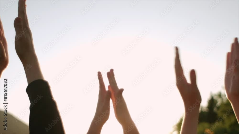 Close up of group people clapping hands at sunset. Family enjoying beautiful summer nature, greeting beautiful day. Slow motion