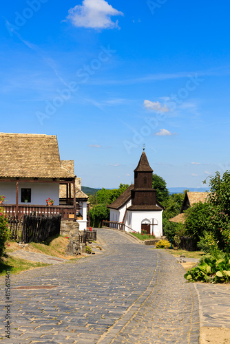 Tableau sur toile Hollókő, Hungary is a lovely etnographic village among mountains with old houses, church and castle