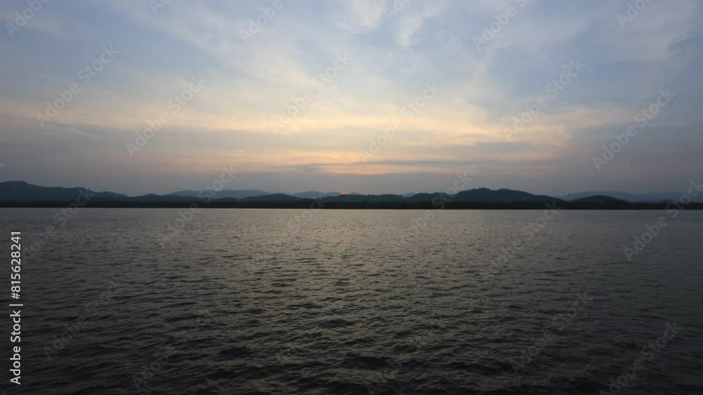 The background of the video is a high angle view of the river, mountains, and large trees surrounding it. The fresh air of the wind blowing blurred at the viewpoint. The background of the video is a high angle view of the river, mountains, and large trees surrounding it. The fresh air of the wind blowing blurred at the viewpoint.