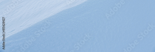 Snow texture. Wind sculpted patterns on snow surface. Wind in the tundra and in the mountains on the surface of the snow sculpts patterns and ridges. Arctic, Polar region. Winter panoramic background.