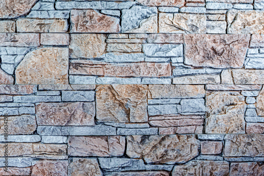 Obraz premium Construction Materials Ideas. Decoration Facing of Black and White Contrasty Long Wall Pavement Stone Sample Tiles