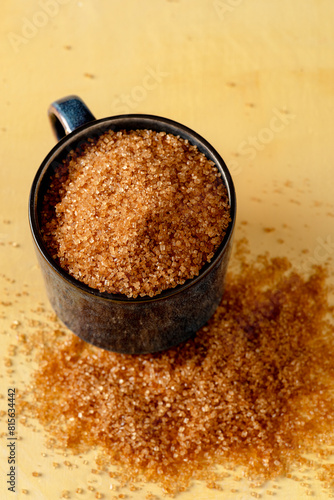 Brown sugar in a cup. View from above