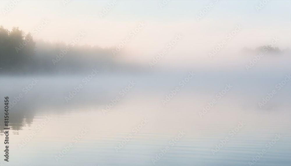 Early morning scene of rolling hills covered in a thick, soft fog under a pale dawn sky. Early morning scene of rolling hills covered in a thick, soft fog under a pale dawn sky.