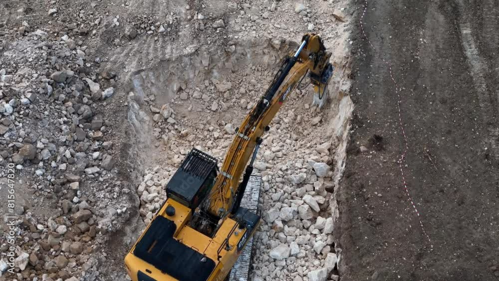 Highway Construction: Drone View of Caterpillar Breaking Rock Highway Construction: Drone View of Caterpillar Breaking Rock