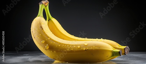 a ripe banana on a white textured background with copy space photo