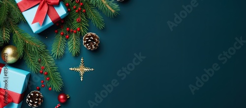 Christmas composition Gifts and fur tree on blue background Top view copy space Nature New Year concept