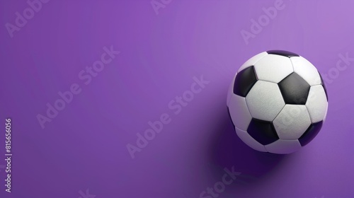Soccer ball placed on purple backdrop