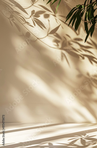 Minimalistic abstract gentle light beige background for product presentation with light andand intricate shadow from the window and vegetation on wall